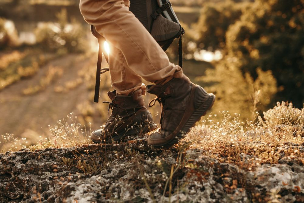 image of person walking with boots on in the woods